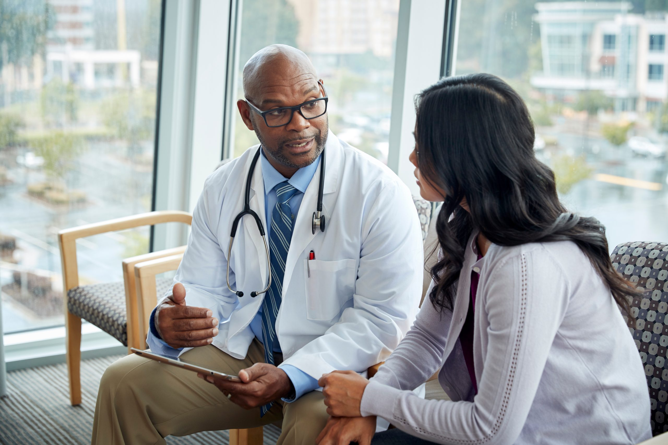 A doctor consulting a patient